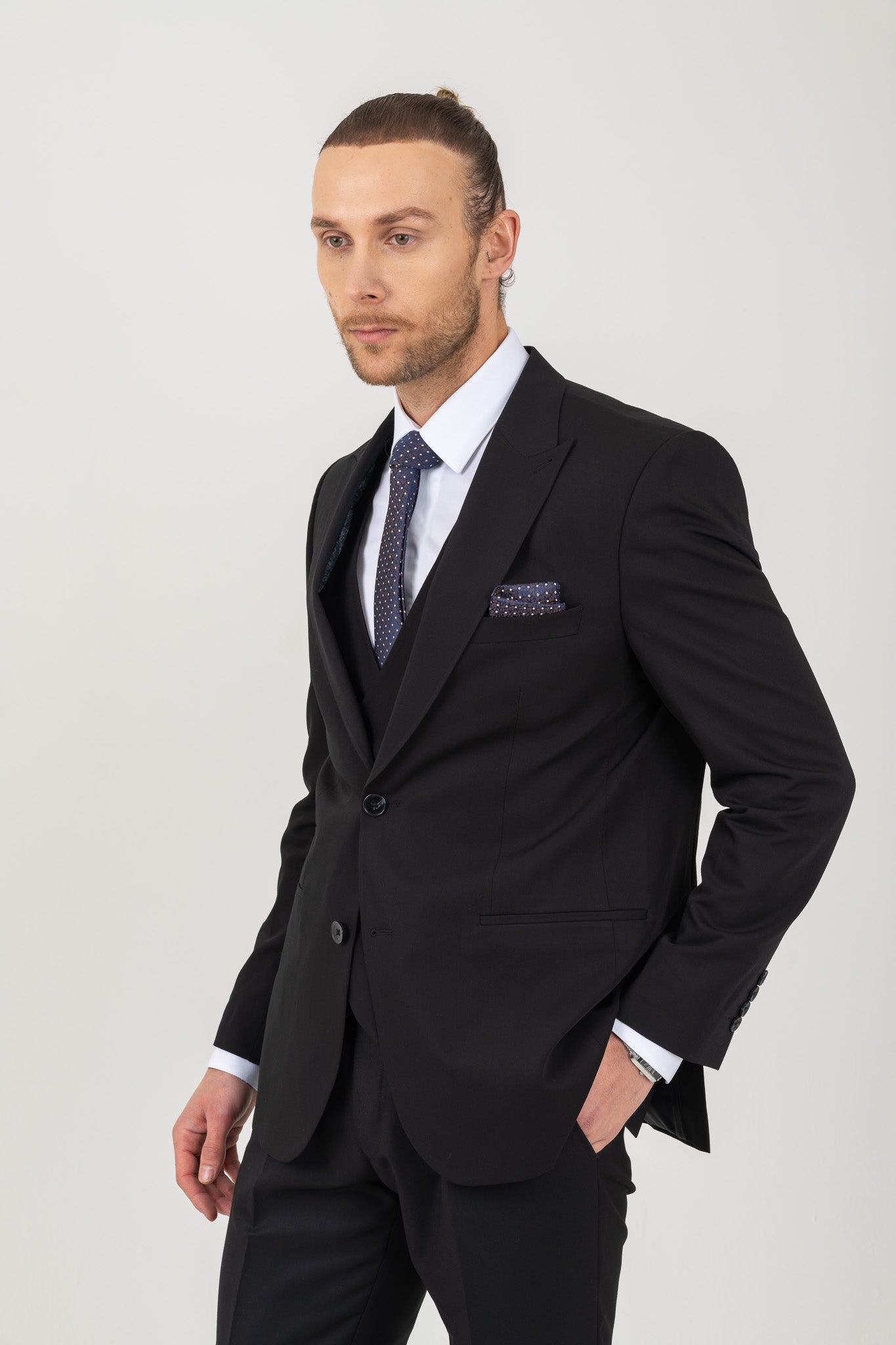 A classic black suit, perfect for any occasion. Timeless elegance and sophistication.