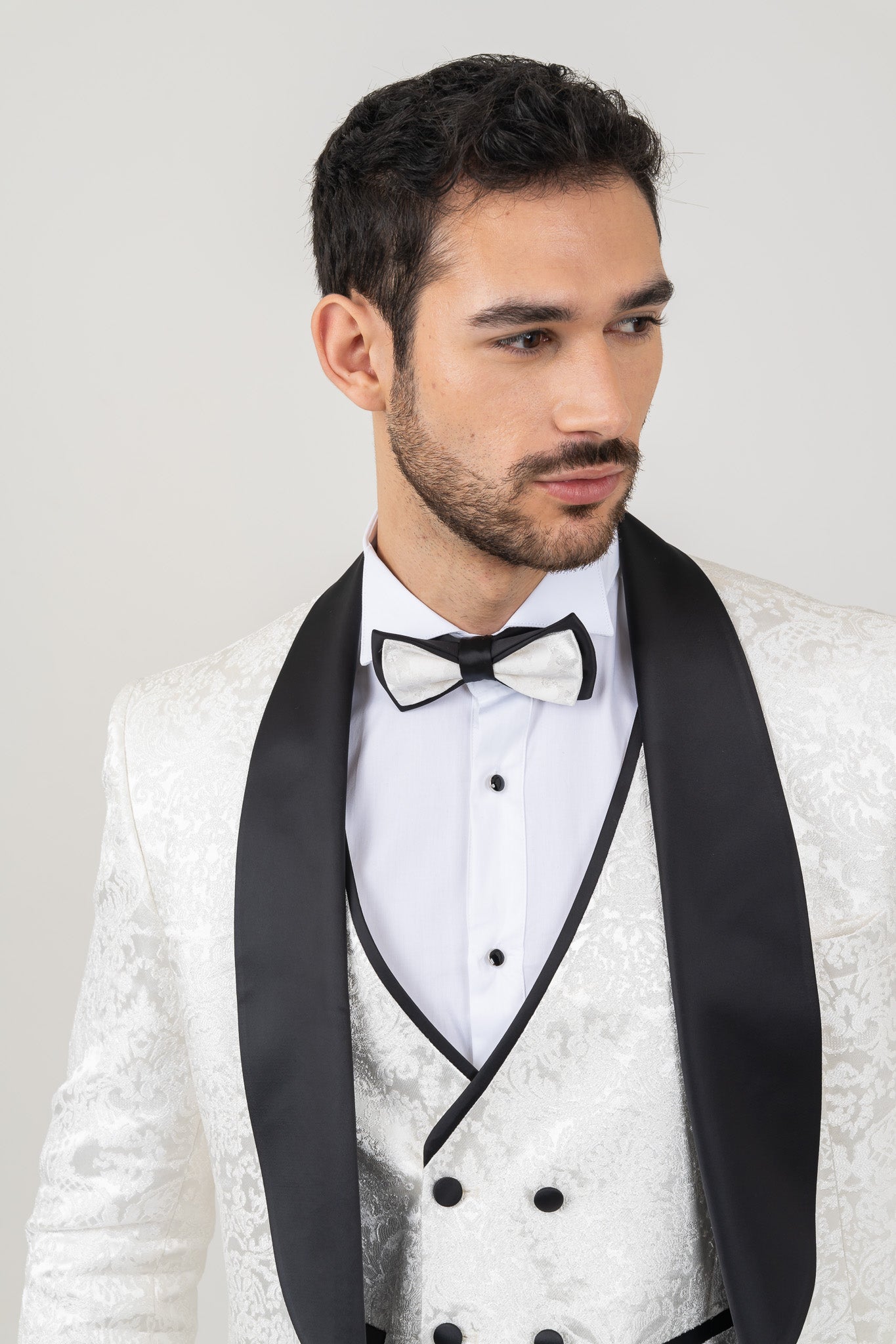 Classic white tuxedo with a shawl neckline, great for black-tie affairs.