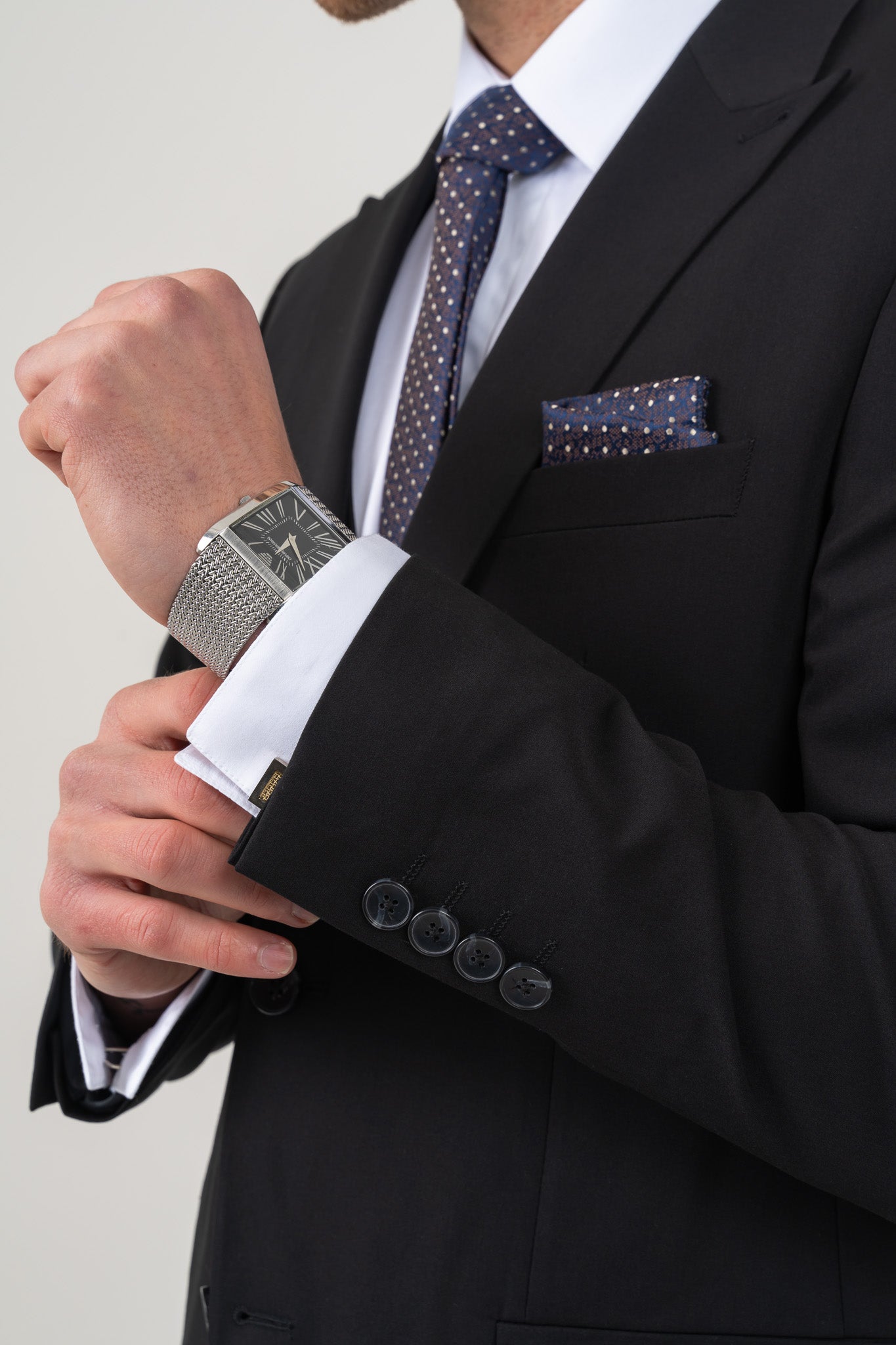 Elegant 3-piece suit with a matching jacket, vest, and trousers, perfect for formal occasions.