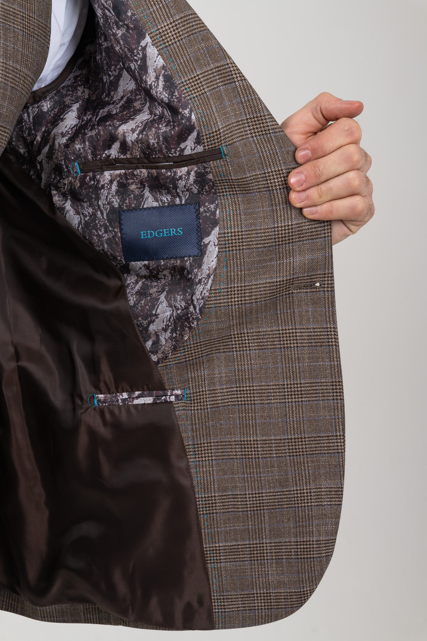 Classic Single One Button Closure Design on a Men's Dark Brown Suit