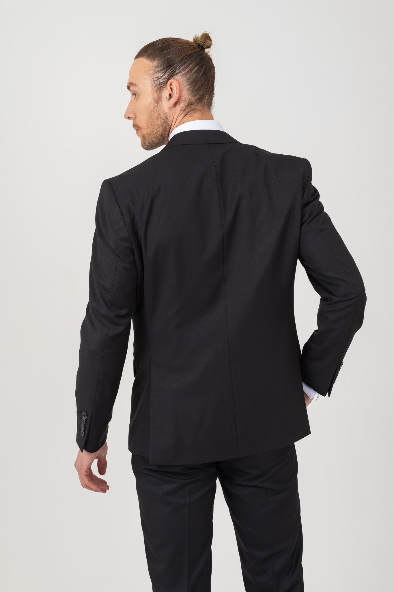 A plain black suit with a classic design and no embellishments. Perfect for formal occasions.