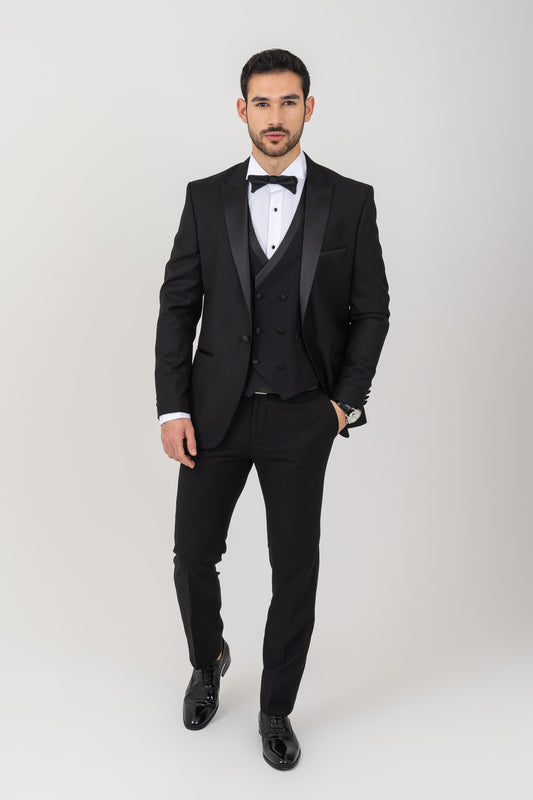 Elegant black tuxedo suit featuring satin peak lapel.