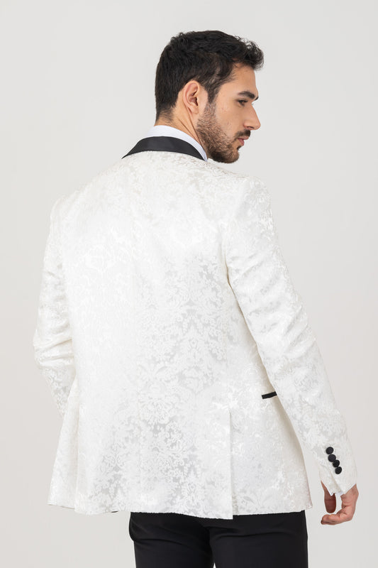 Stylish groom in a sharp suit, looking dapper for his big day.