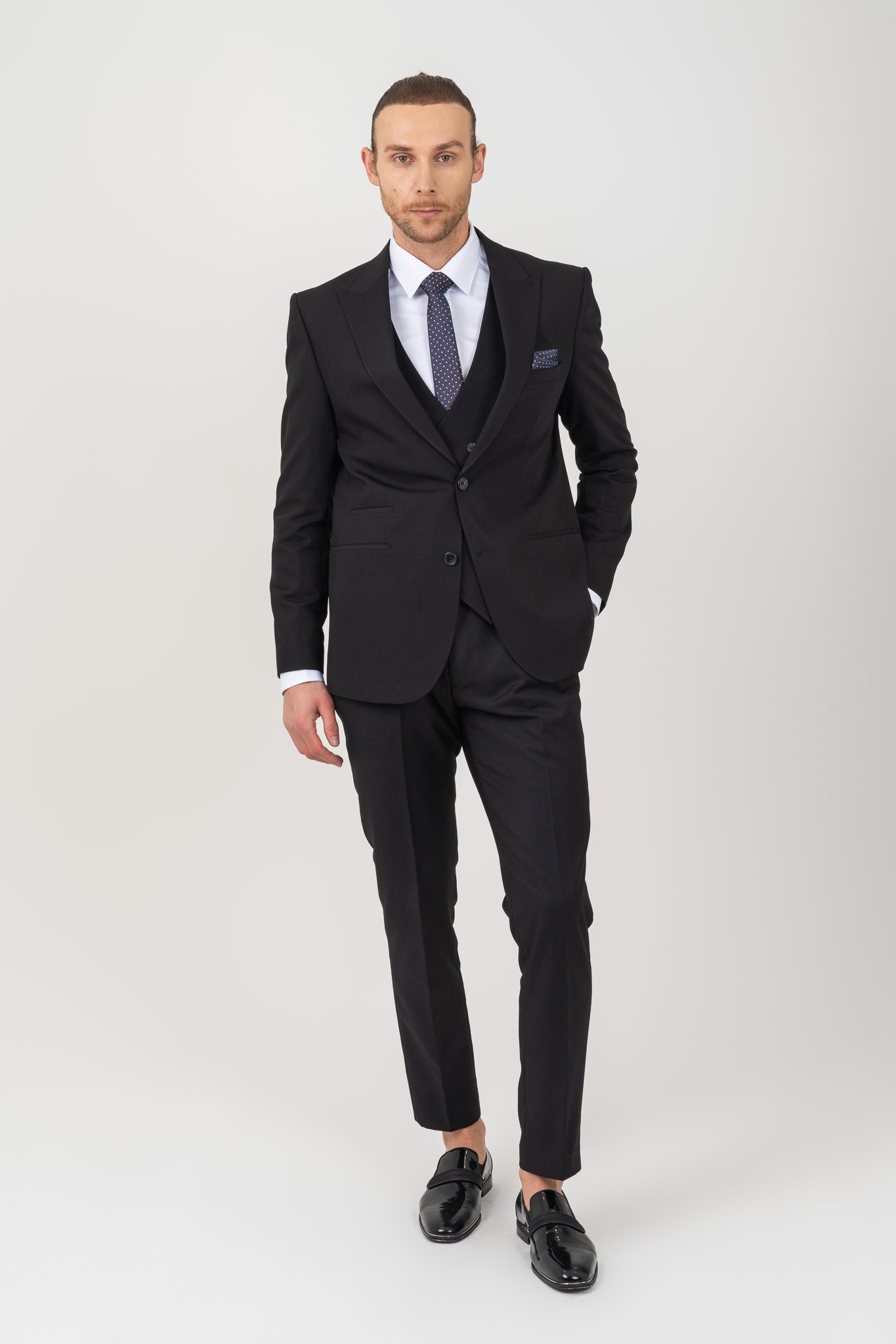 Sophisticated wedding suit with classic peak lapel, adding a touch of classic elegance to your special day.