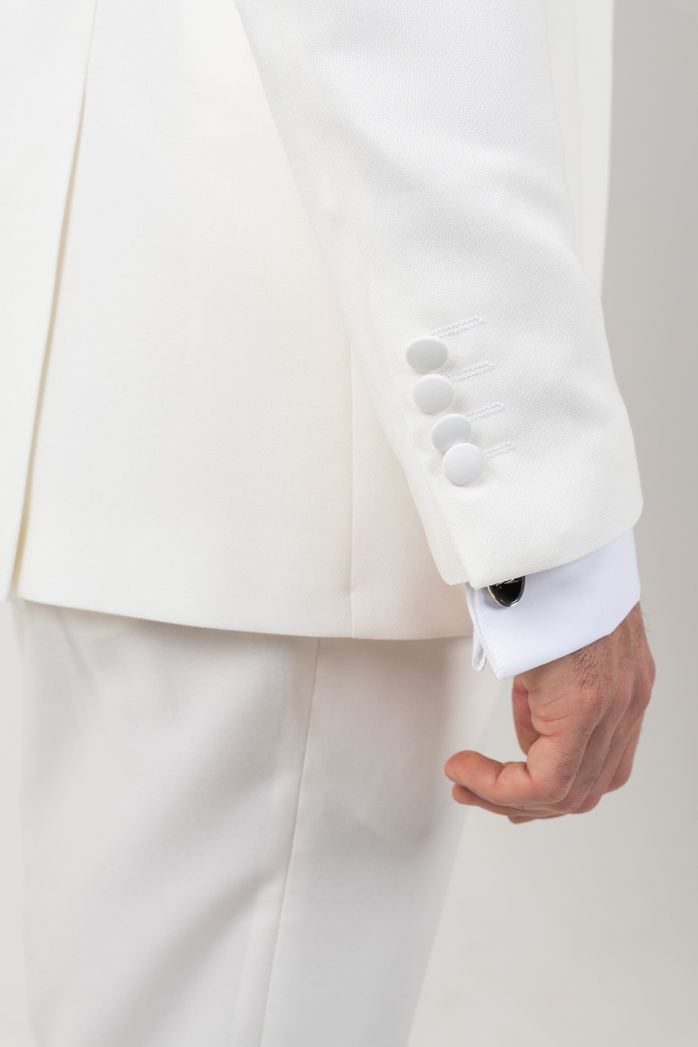 Full white groom suit with a tailored fit, featuring a crisp white jacket, matching trousers and tie