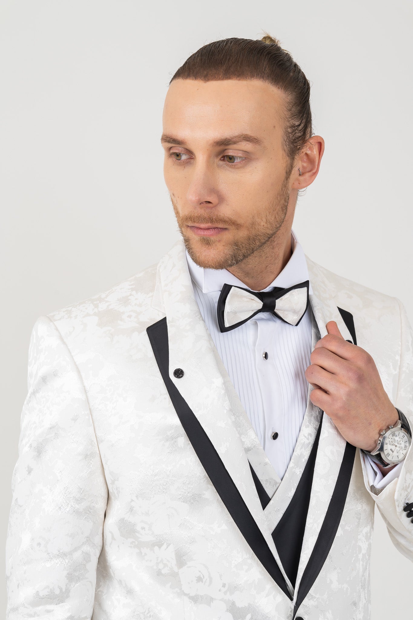 Stylish removable mono lapel on a white tuxedo suit
