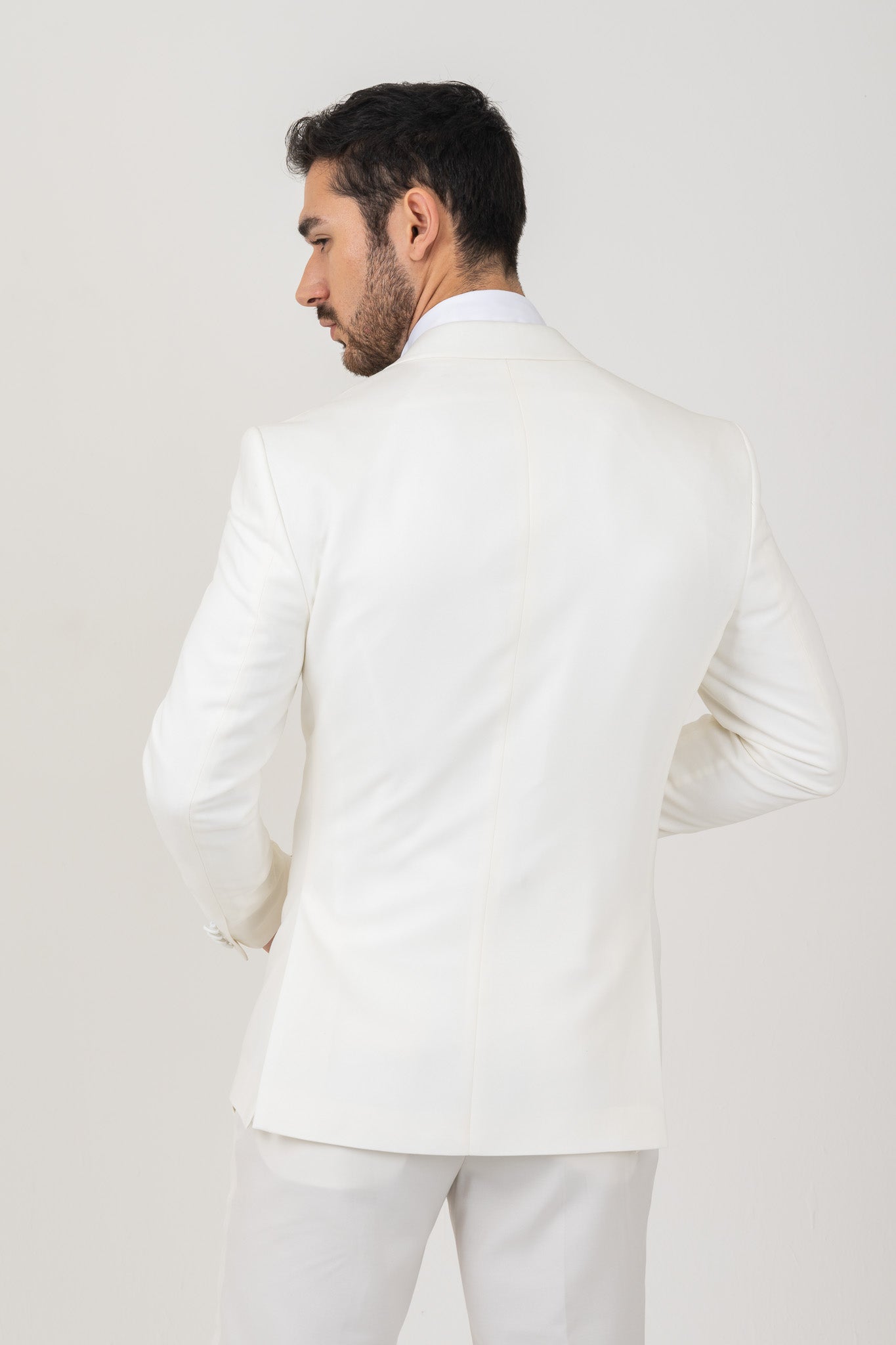 This white notch lapel tuxedo Suit by Envy is a formalwear classic