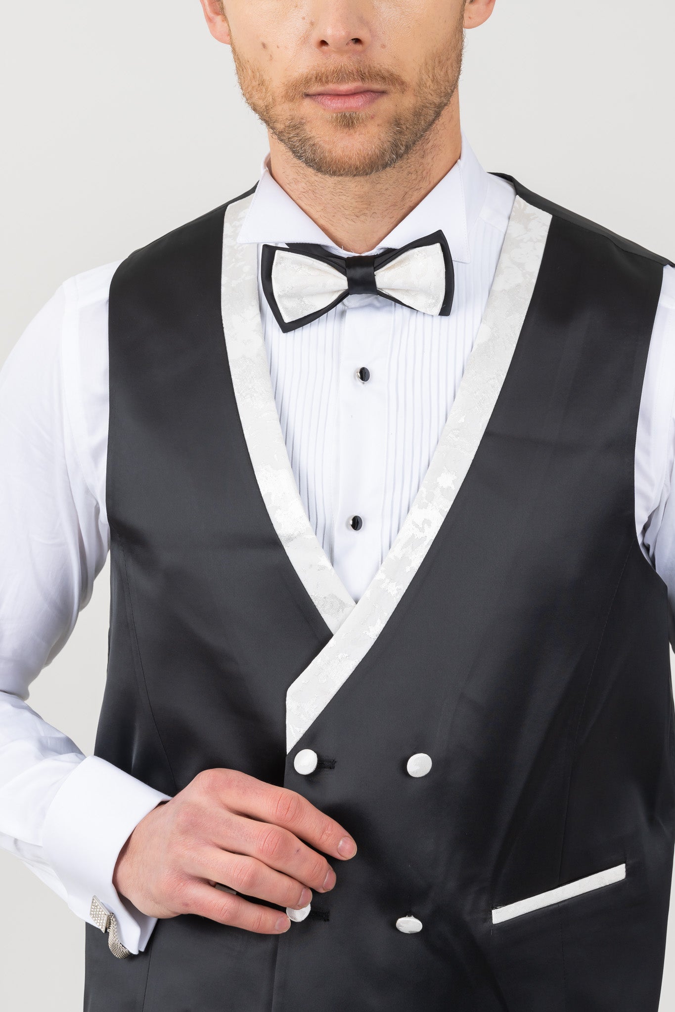 Close-up of embossed print on a white wedding tuxedo suit.