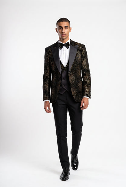 Man wearing a gold starburst velvet tuxedo with a satin peak lapel and double breasted waistcoat