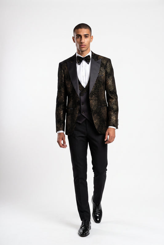 Man wearing a gold starburst velvet tuxedo with a satin peak lapel and double breasted waistcoat