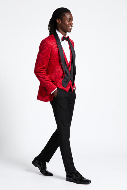 Man wearing a red jacquard tuxedo with a black satin shawl lapel and cross strap waistcoat