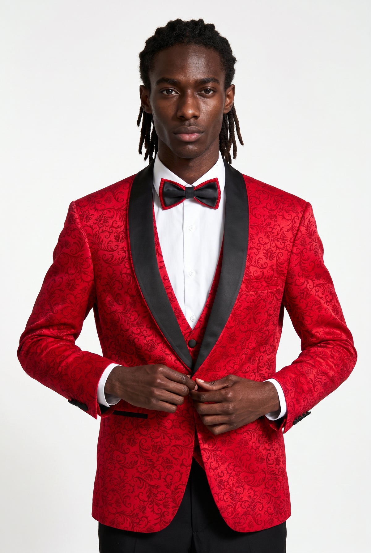 Half body view of the black satin cross-strap waistcoat on a red jacquard tuxedo