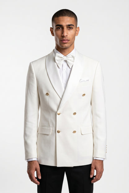 Man wearing a white double breasted tuxedo with a satin shawl lapel and gold buttons